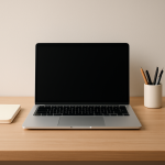 Laptop Battery Draining While Idle — Deep Power Leak Causes and Fixes Idle laptop on tidy desk with notebook and coffee cup